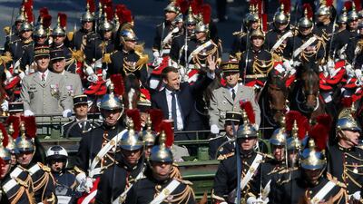 French President Emmanuel Macron and Chief of the Defence Staff French Army General Pierre de Villiers arrive in a command car for the traditional Bastille Day military parade on the Champs-Elysees in Paris, France, July 14, 2017. REUTERS/Gonzalo Fuentes