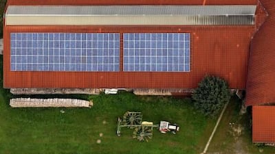 Buildings equipped with solar panels, such as this barn in Germany, are common in Europe, but Arab countries are quickly catching up.
