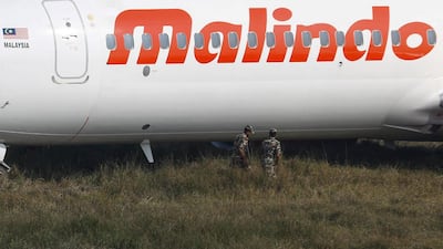 Nepalese security forces examine the Malindo Air plane. Narendra Shrestha / EPA