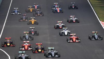 Mercedes-GP driver Lewis Hamilton, left, leads the race. Mohd Rasfan / AFP