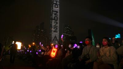 People watch a New Year's Eve concert in Hong Kong. AP