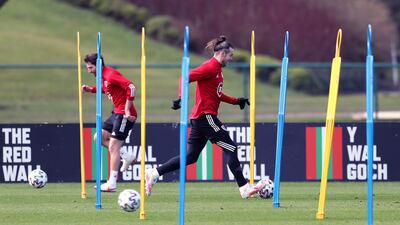 Wales' Gareth Bale and Joe Allen during training. PA