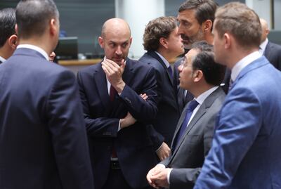 France's Foreign Minister Jean-Noel Barrot, centre, among a group talking after the European Foreign Affairs Council meeting in Brussels on Monday. EPA