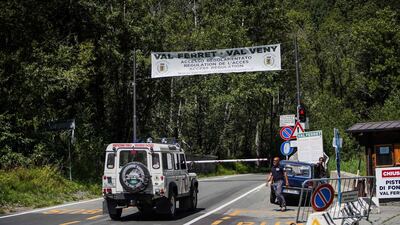 An Italian 'Protezione Civile' (Civil Protection), rescue and search vehicle for aid is waiting at the local police checkpoint in the village of La Palud. AFP