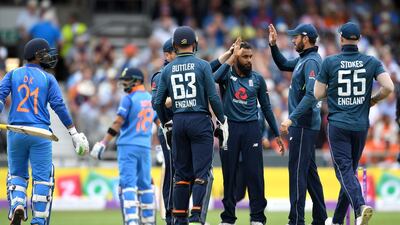 Adil Rashid dismissed both Dinesh Karthik, left, and captain Virat Kohli in Headingley on Tuesday. Gareth Copley / Getty Images