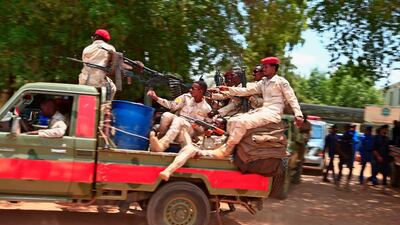 Sudanese security forces deploy outside the Khartoum courthouse during a trial session of Sudan's ousted president Omar Al Bashir along with others, in the Sudanese capital on August 25, 2020. AFP