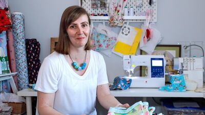 Katrina van Dinter, who owns Petite Lamb, a small business making children’s clothes in Dubai, sews mittens and blankets for koalas burnt by the bushfires in her home country of Australia. Victor Besa / The National