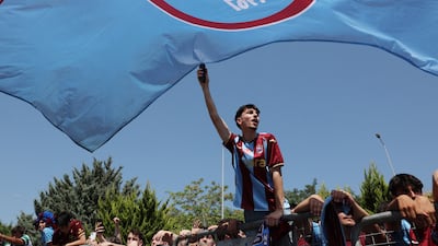 Trabzonspor fans wait for the arrival of Mohamed Salah outside the airport. Reuters