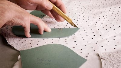 The ostrich leather is hand-cut for the production of the Headline shoes. Louis Vuitton Malletier / Grégoire Vieille