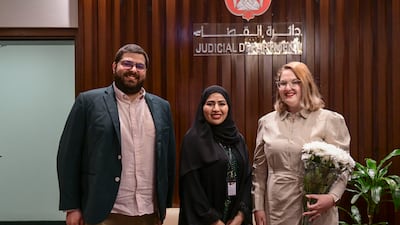 An Emirati court official smiles as the process is complete.