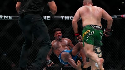 Alonzo Menifield is knocked down by Azamat Murzakanov during their bout at UFC Fight Night Abu Dhabi.