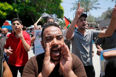 Palestinians in Gaza City shout slogans during a protest against the U's Middle East economic conference in Bahrain. AFP