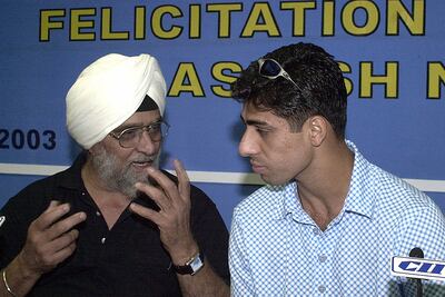 Bishan Singh Bedi with India pacer Ashish Nehra. AFP