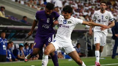 Al Ain, in purple, drew their last Asian Champions League game against Pakhtakor. Marwan Naamani / AFP