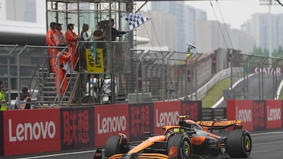 McLaren driver Lando Norris crosses the finish line to finish second. AP