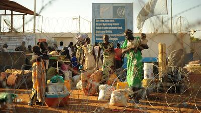 Residents of Juba seek shelter from fighting at the UN compound in South Sudan on December 20. The UN says 34,000 people have sought refuge at its bases in the country. Tony Karumba / AFP
