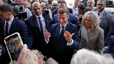 Mr Macron and his wife make their way to historic Jackson Square in New Orleans. AP