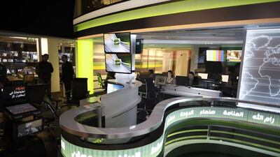 Alarab staff are seen on duty at the editorial office in Manama, Bahrain on December 15, 2014. Mohammed Al Shaikh/AFP Photo