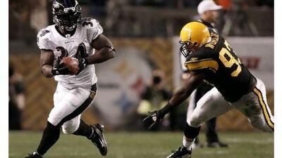 Ricky Williams, left, in action for Baltimore, has settled into a role as back-up to Ray Rice at Baltimore.