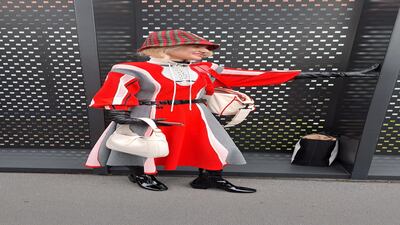 One visitor's striped dress and bucket hat