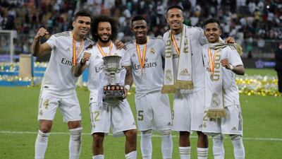 From left to right, Real Madrid's Casemiro, Real Madrid's Marcelo, Real Madrid's Vinicius Junior, Real Madrid's Eder Militao and Real Madrid's Rodrygo celebrate end the Spanish Super Cup Final soccer match between Real Madrid and Atletico Madrid at King Abdullah stadium in Jeddah, Saudi Arabia, Sunday, January 12, 2020. AP Photo/Hassan Ammar