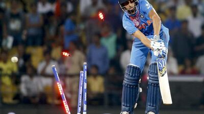India's Ashish Nehra is bowled during the ICC World Twenty20 2016 cricket match against New Zealand at the Vidarbha Cricket Association stadium in Nagpur, India, Tuesday, March 15, 2016. (AP Photo/Saurabh Das)