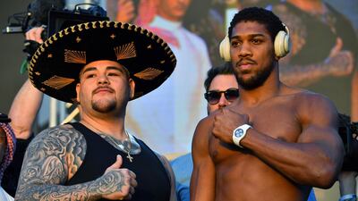 Mexican-American heavyweight boxing champion Andy Ruiz Jr (L) and British heavyweight boxing challenger Anthony Joshua pose during the official weigh-in at Diriyah in the Saudi capital Riyadh, on December 6, 2019, ahead of the upcoming "Clash on the Dunes". AFP / Giuseppe CACACE