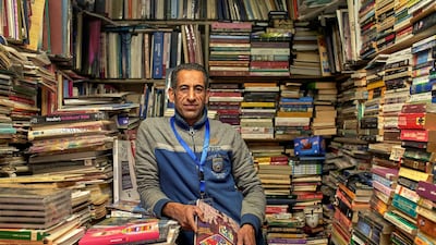 Ahmed Abdel-Fattah runs a second-hand book stall in Soor El Azbakeya and is one of many vendors who will not attend the Cairo International Book Fair this year. Courtesy Hamada Elrasam