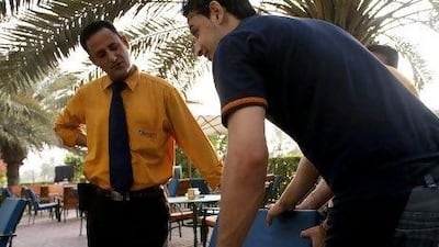 Egyptian expatriate Yahia Abdeljawad Almutwaili, 39, left, a waiter at Special Cafe in Abu Dhabi on May 25, 2012. Almutwaili voted in the Egyptian election and is not optimistic about the future of the country. Christopher Pike / The National