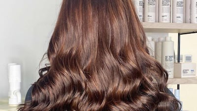 Natural, glossy brunette with depth and dimension added by way of low contrast and mid-tone highlights is a top hair colour trend for 2023. Photo: Tara Rose Salon