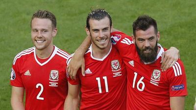 Wales’ Chris Gunter, Gareth Bale and Joe Ledley celebrate after the match against Slovakia at Euro 2016. Regis Duvignau / Reuters