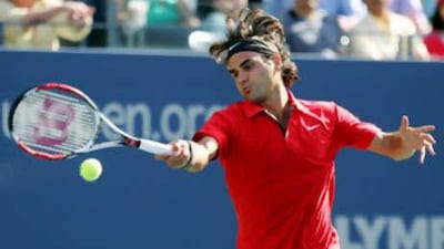 Roger Federer returns to Thiago Alves of Brazil.