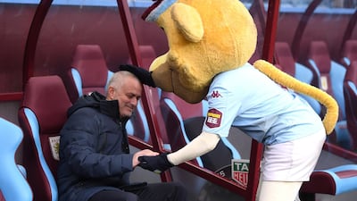 Jose Mourinho with the Aston Villa mascot. Getty