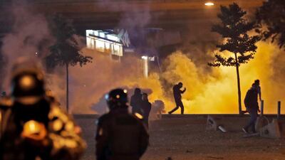 Supporters of Lebanon's Hezbollah and Amal groups clash with security forces late on December 17, 2019 in central Beirut. AFP
