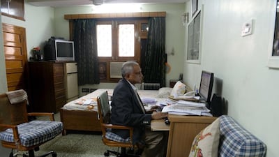 India's most tireless corruption fighter Subhash Agrawal works at a computer in his home in the old quarters of New Delhi. AFP