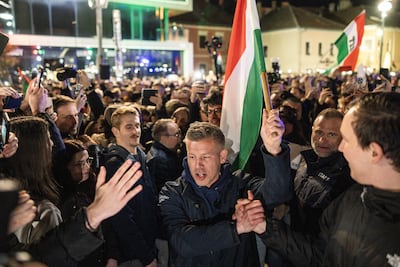 Tisza party leader Peter Magyar, centre, with supporters at a rally. Bloomberg