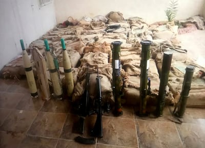 Weapons and other unidentified supplies seized by the army. Photo: Petra News Agency