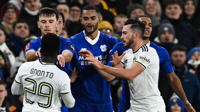 Leeds United striker Wilfried Gnonto argues with Cardiff players. AFP