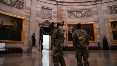 Members of the National Guard visit the US Capitol Rotunda. Reuters