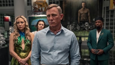 Daniel Craig, centre, stars as Benoit Blanc in the Knives Out mystery film series that is being adapted into a Netflix party game. Photo: Netflix