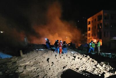 Rescuers work at the site of an Israeli air strike in the southern Lebanese village of Toul. AFP