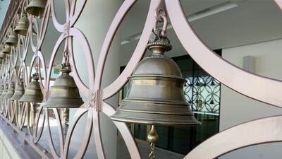 As they enter the temple complex, visitors can ring a series of large brass bells. Pawan Singh / The National