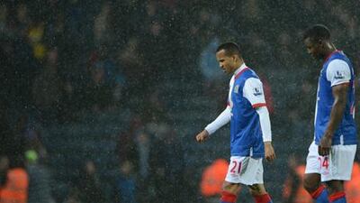 Blackburn's Marcus Olsson, left, and Yakubu walk from the pitch during their 1-0 loss to Wigan's in their English Premier League soccer match at Ewood Park Stadium, Blackburn, England, Monday May 7, 2011. The loss relegated Blackburn from the Premier League. (AP Photo/Jon Super)