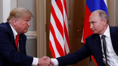 Donald Trump and Vladimir Putin shake hands as they meet in Helsinki. Reuters
