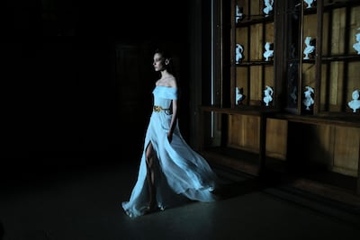 Rami Al Ali Couture spring 2023 showcased metallics in the form of pale silvery blue pleated evening gowns. Getty Images