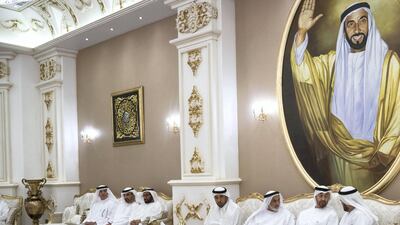 Sheikh Mohamed bin Zayed visits the house of Maj Gen (Ret) Al Mazrouei (L), in Khalifa City. Seen with Mohammed Al Remeithi (3rd L). Hamad Al Kaabi / Ministry of Presidential Affairs