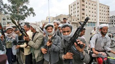 Armed tribesmen, in charge of protecting anti-government protestors demanding the resignation of Yemeni President Ali Abudullah Saleh, gather in a street in Taiz, Yemen today.