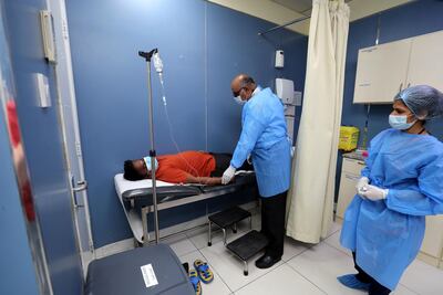 Dr Sanjay Paithankar runs clinics that treat workers near their accommodation across the UAE. He has seen many cases of reinfection among workers. Chris Whiteoak / The National