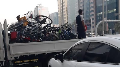 Bicycles confiscated by police are piled high in a lorry in this picture taken by one owner.