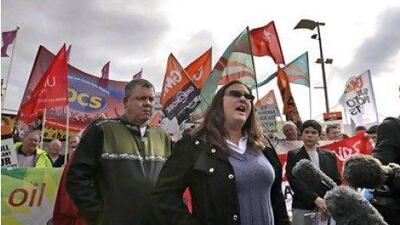 Protesters including Gulf Coast residents affected by the oil spill demonstrate outside the venue where BP held its annual general meeting.